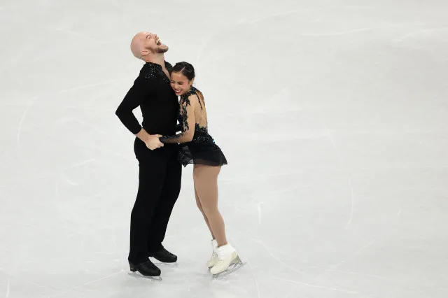 Ellie Kam and partner Danny O'Shea of Team United States embrace after competing in Pair Skating - Free Skating Team Event on day two of the Milano Cortina 2026 Winter Olympic games at Milano Ice Skating Arena on February 08, 2026 in Milan, Italy.