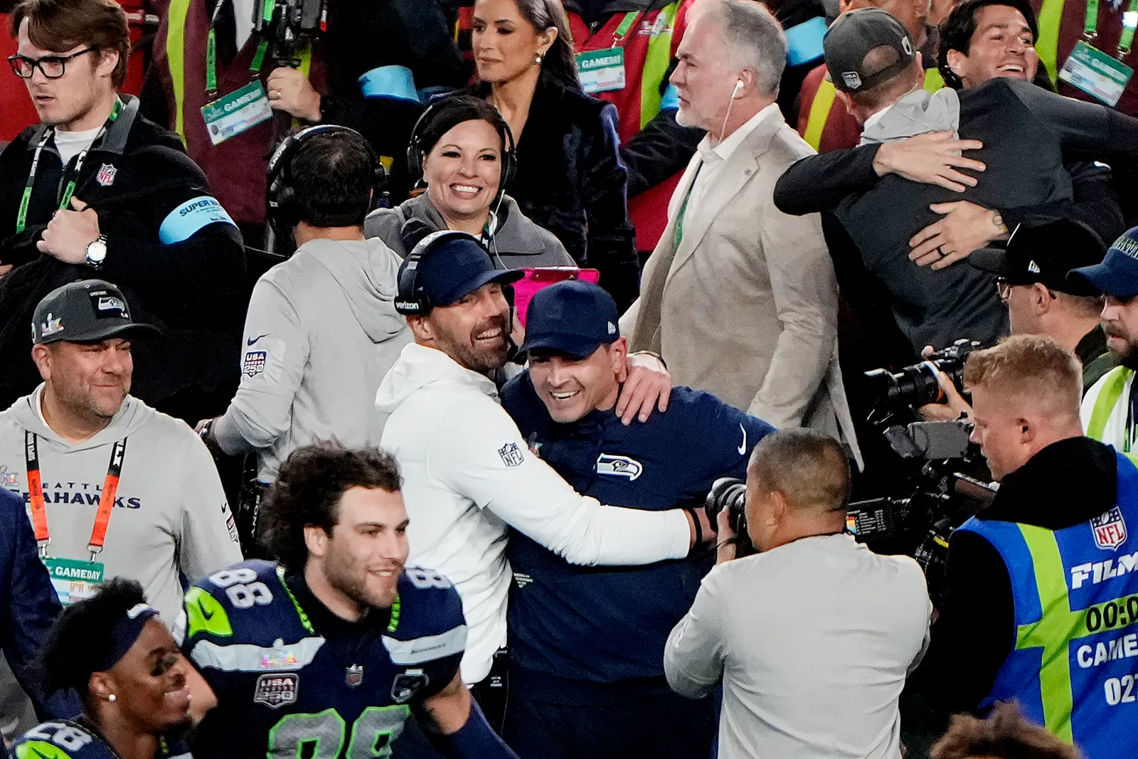 SANTA CLARA, CALIFORNIA - FEBRUARY 08: Head coach Mike MacDonald of the Seattle Seahawks is hugged by offensive coordinator Klint Kubiak after a 29-13 win against the the New England Patriots in Super Bowl LX at Levi's Stadium on February 08, 2026 in Santa Clara, California. (Photo by Thearon W. Henderson/Getty Images)