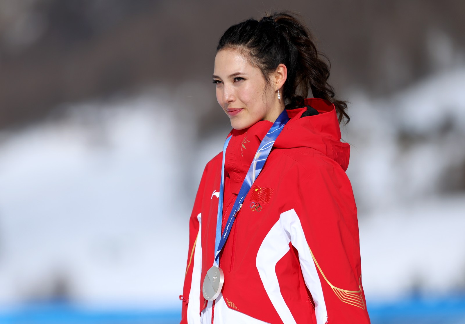Silver medalist Ailing Eileen Gu of Team People’s Republic of China looks on from the podium after the Women’s Slopestyle Final on day three of the Milano Cortina 2026 Winter Olympic games at Livigno Snow Park on February 09, 2026 in Livigno, Italy. (Photo by Cameron Spencer/Getty Images)