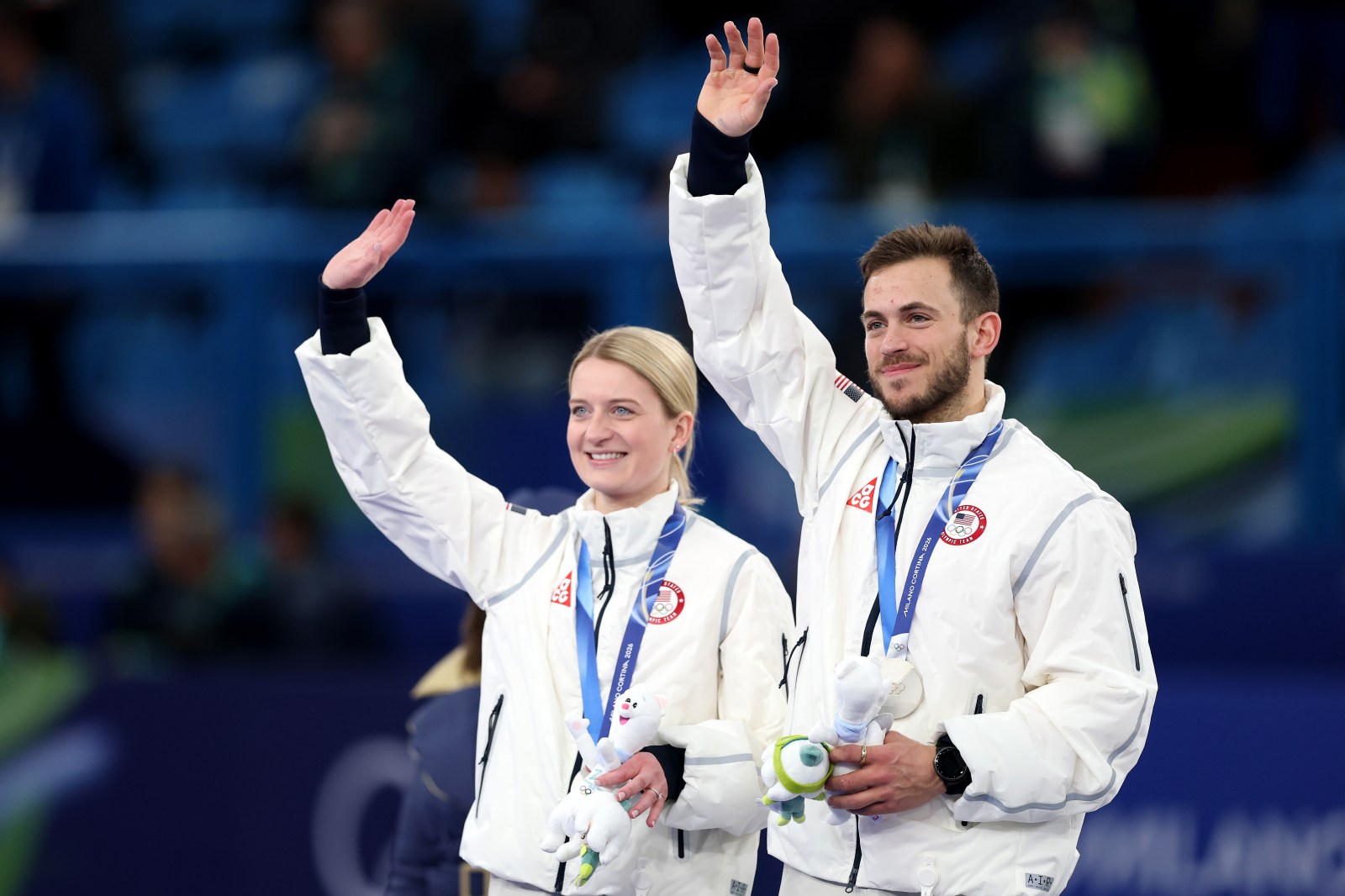 CORTINA D’AMPEZZO, ITALY – FEBRUARY 10: Silver medalists Korey Dropkin and Cory Thiesse of Team United States celebrate on the podium after the Mixed Doubles Gold Medal Game on day four of the Milano Cortina 2026 Winter Olympic games at Cortina Curling Olympic Stadium on February 10, 2026 in Cortina d’Ampezzo, Italy. (Photo by Ezra Shaw/Getty Images)