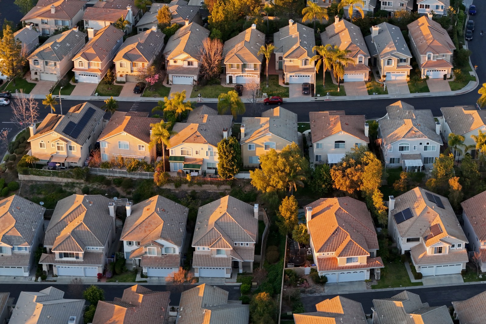 In an aerial view, two-story single family homes line the streets of neighborhood on January 13, 2026, in Thousand Oaks, California.