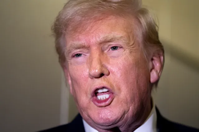 Donald Trump speaks to members of the media aboard Air Force One while flying from Palm Beach International Airport on February 16, 2026 en route to Washington, DC.