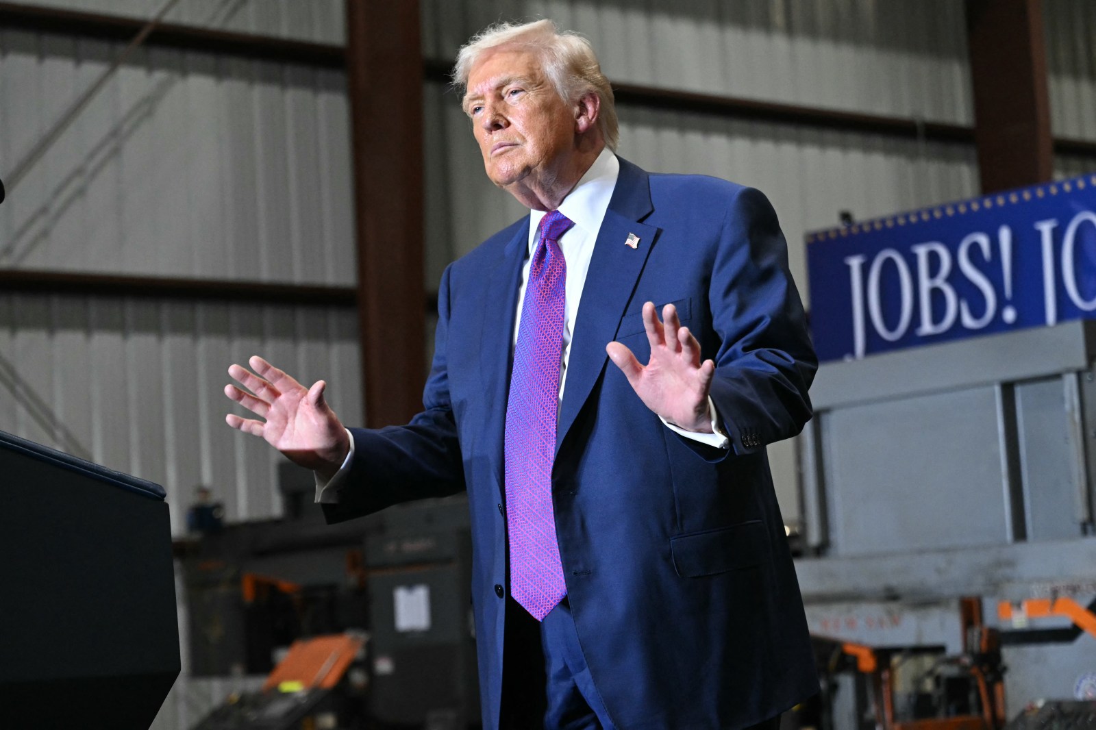 US President Donald Trump gestures at the end of his speech after touring the Coosa Steel Corporation factory in Rome, Georgia, February 19, 2025. (Photo by SAUL LOEB / AFP via Getty Images)