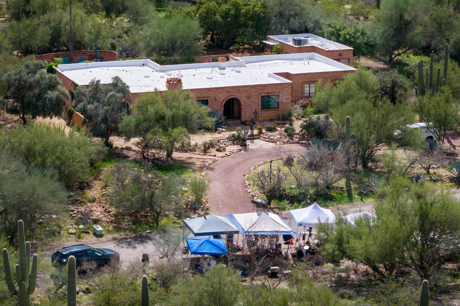 In an aerial view, Nancy Guthrie’s residence is seen on February 17, 2026 in Tucson, Arizona. Searches continue for Nancy Guthrie, the 84-year-old mother of U.S. journalist and television host Savannah Guthrie, after she went missing from her home on the morning of February 1. (Photo by Brandon Bell/Getty Images)