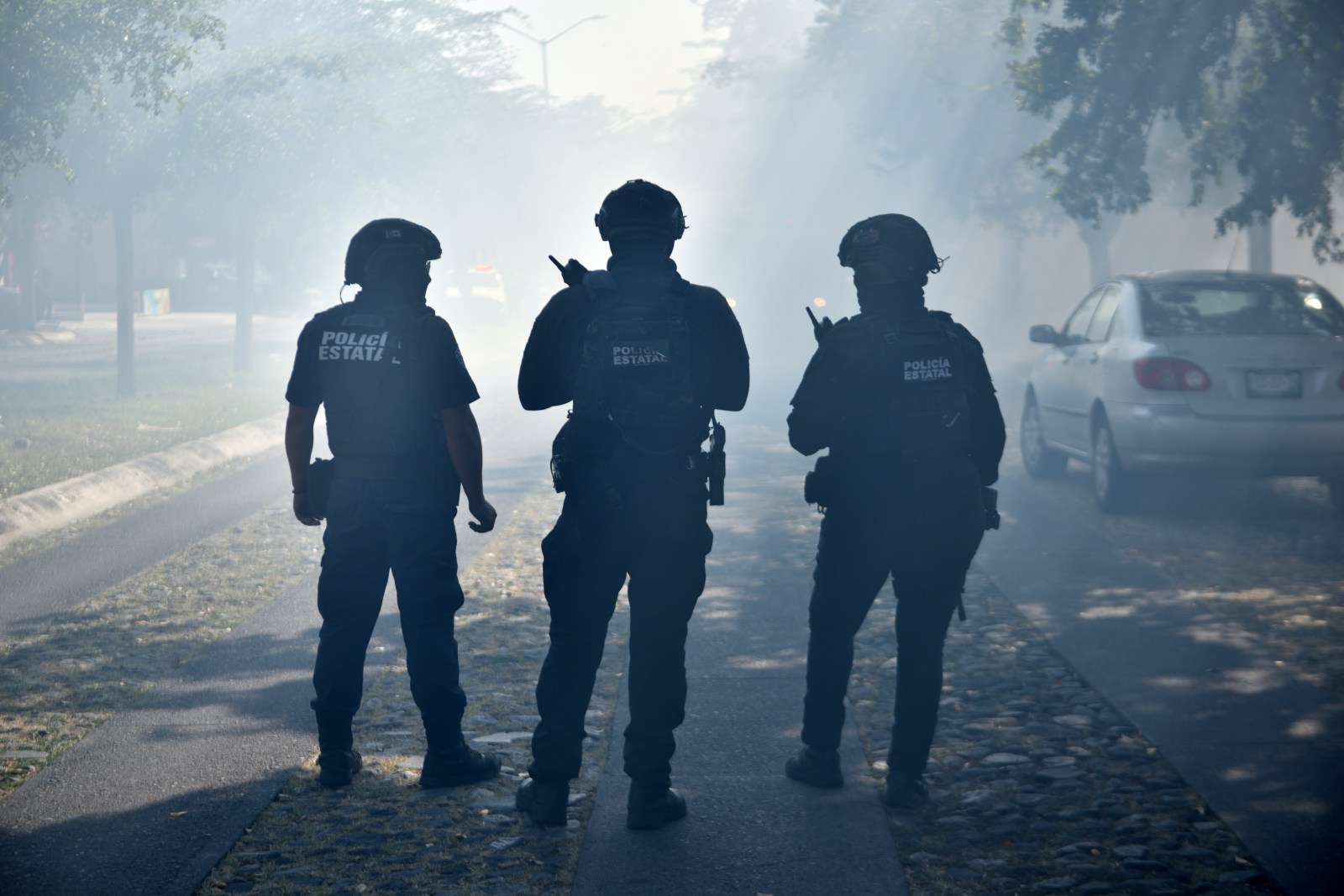 Police officers patrol a street on February 22, 2026 in Colima, Mexico, after the killing of Nemesio Oseguera Cervantes, known as ‘El Mencho.’