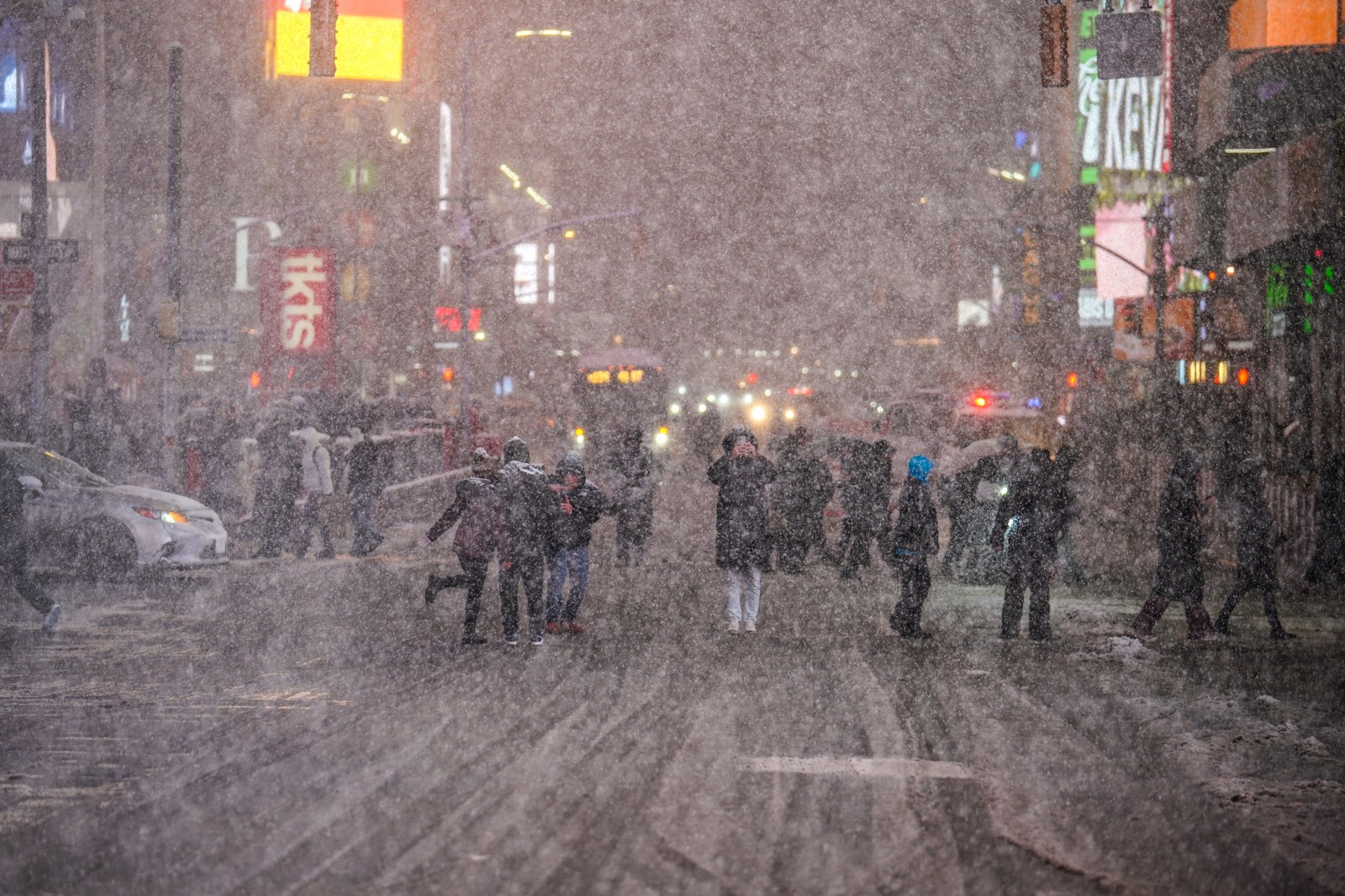 NEW YORK, NEW YORK – FEBRUARY 22: People admire the snow in Times Square on February 22, 2026 in New York City. A major winter storm is expected to hit the Northeast and Mid-Atlantic regions, bringing blizzard conditions with the potential for up to 23 inches of snow in New York City. A blizzard warning has been issued for large areas of the East Coast.  (Photo by Ryan Murphy/Getty Images)