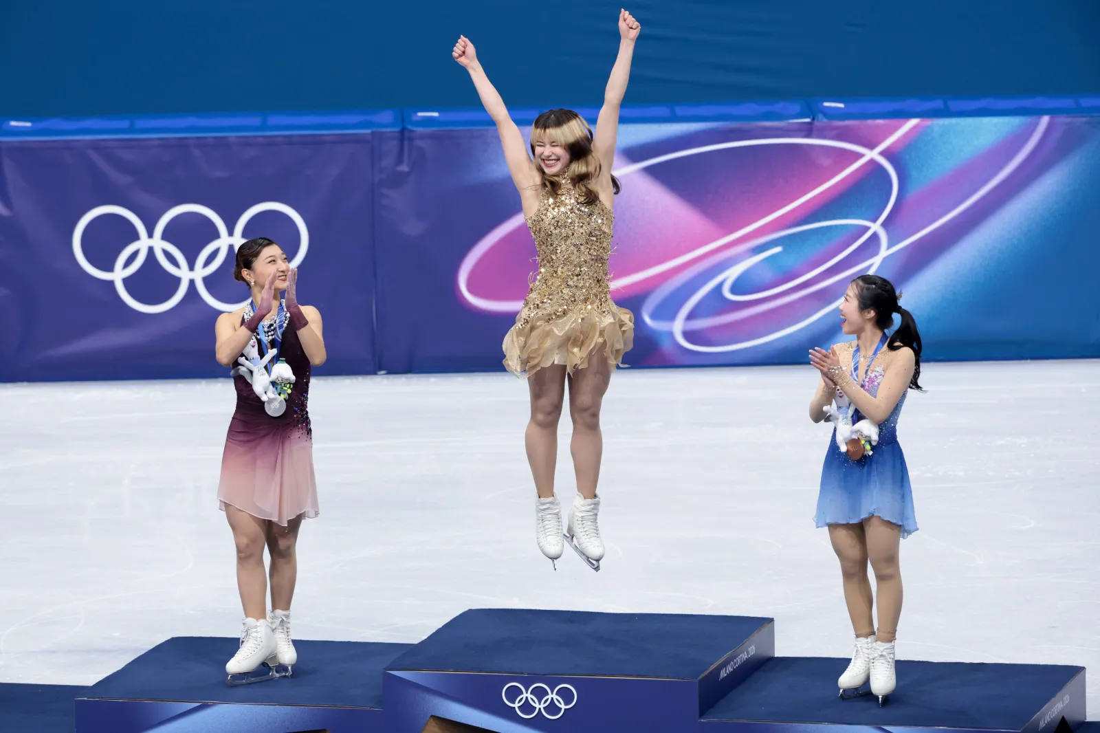 MILAN, ITALY - FEBRUARY 19: From left, Silver medalist Kaori Sakamoto of Japan, Gold medalist Alysa Liu of United States, Ami Nakai of Japan during the victory ceremony for the Figure Skating Women Single Skating event on day thirteen of the Milano Cortina 2026 Winter Olympic Games at Milano Ice Skating Arena on February 19, 2026 in Milan, Italy. (Photo by Jean Catuffe/Getty Images)