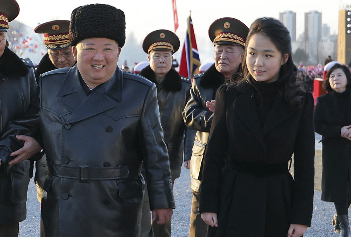 This photo released February 15, 2026, by state media shows North Korean leader Kim Jong Un, center, and his daughter Ju Ae, center right, attending the inauguration ceremony of Saeppyol Street in Pyongyang.