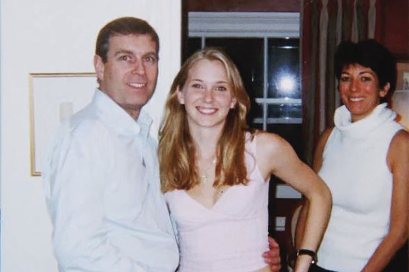 A photograph appearing to show Prince Andrew with Virginia Roberts Giuffre and Ghislaine Maxwell.