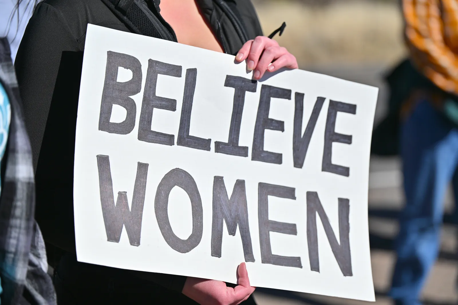 A sign as New Mexico lawmakers join the Women's March for International Women's Day Rally targeting Jeffrey Epstein's Zorro Ranch on March 8, 2026, near Stanley, New Mexico.