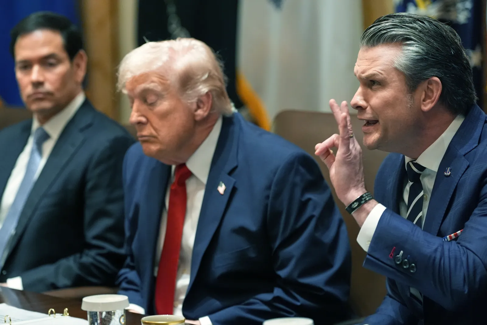 Defense Secretary Pete Hegseth speaks as President Donald Trump and Secretary of State Marco Rubio listen during a Cabinet meeting at the White House on March 26 in Washington. (AP Photo/Alex Brandon)