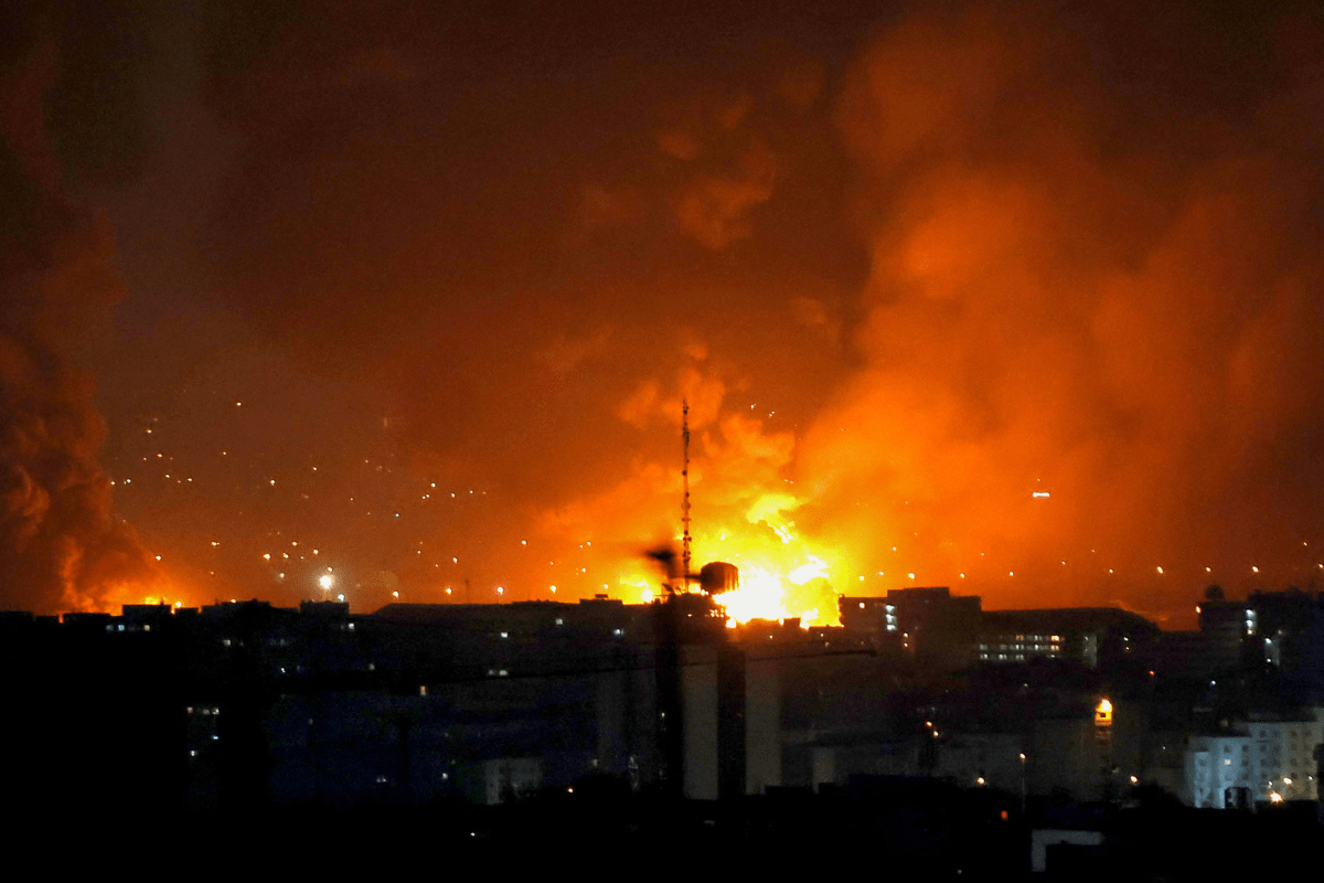 Smoke and fire rise from the site of airstrikes at Mehrabad International Airport in Tehran on March 7, 2026