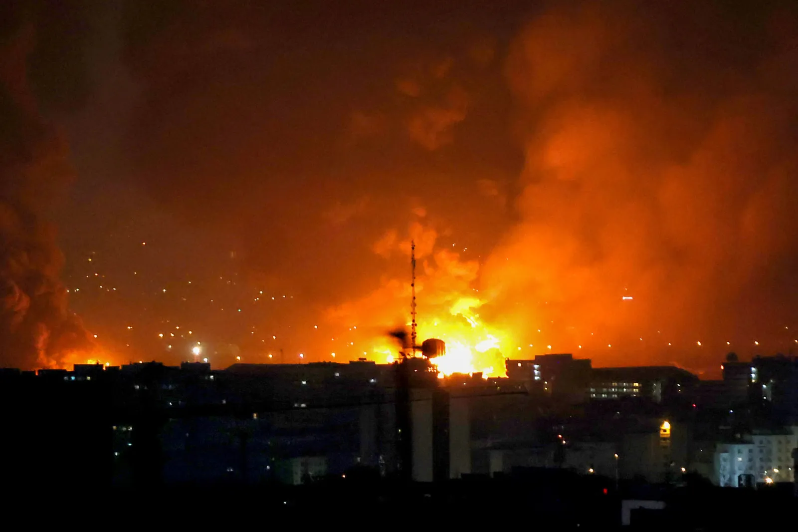 Smoke and fire rise from the site of airstrikes at Mehrabad International Airport in Tehran on March 7, 2026.