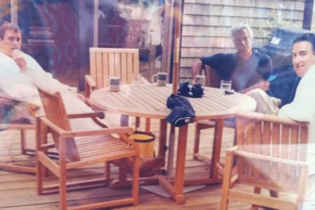 Image discovered in a release from the US Department of Justice shows Andrew Mountbatten‑Windsor and Peter Mandelson wearing bathrobes while seated alongside Jeffrey Epstein