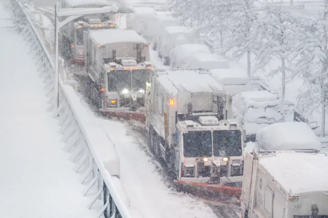 now plowing trucks clear the streets of snow during winter storm on the Upper West Side on February 23, 2026 in New York, New York.