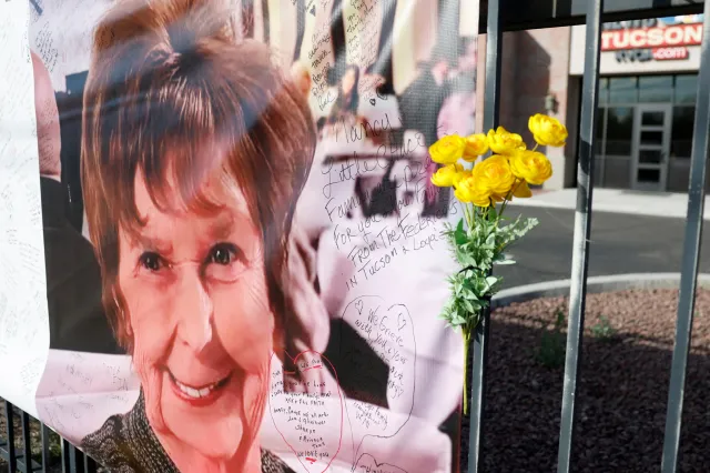 A photograph of Nancy Guthrie is displayed on a banner in front of the KVOA television station on March 01, 2026 in Tucson, Arizona