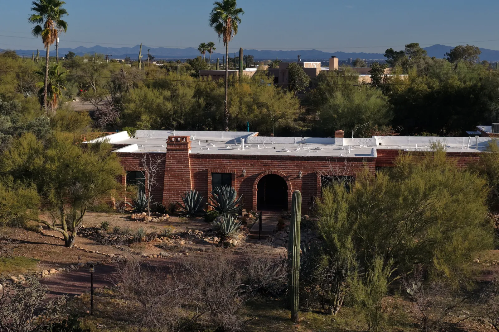 In an aerial view, the home of Nancy Guthrie is shown on March 02, 2026 in Tucson, Arizona
