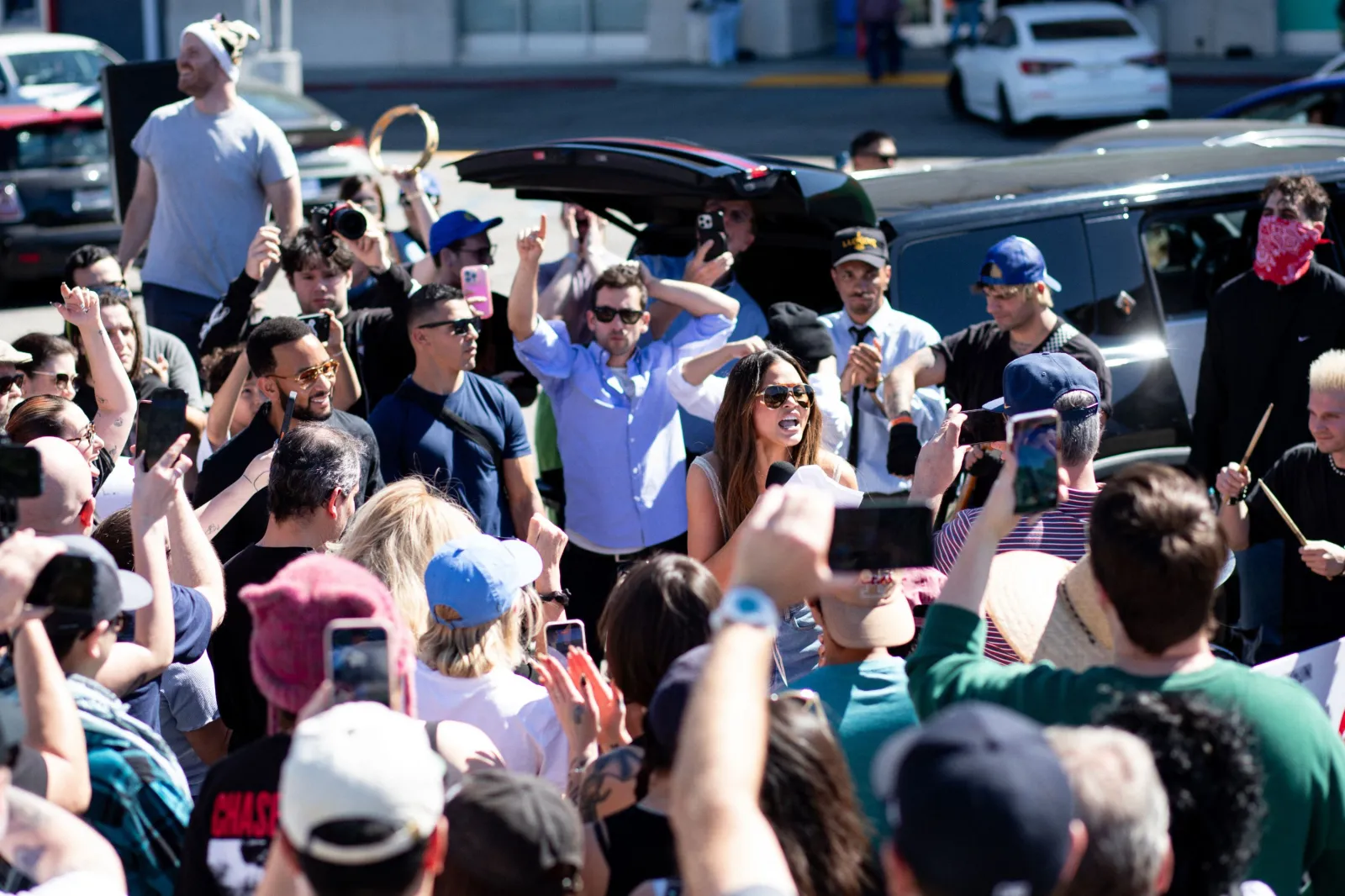 Chrissy Teigen speaking at rally