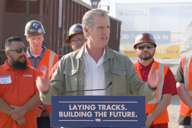 California Governor Gavin Newsom speaking on a visit to the site in February