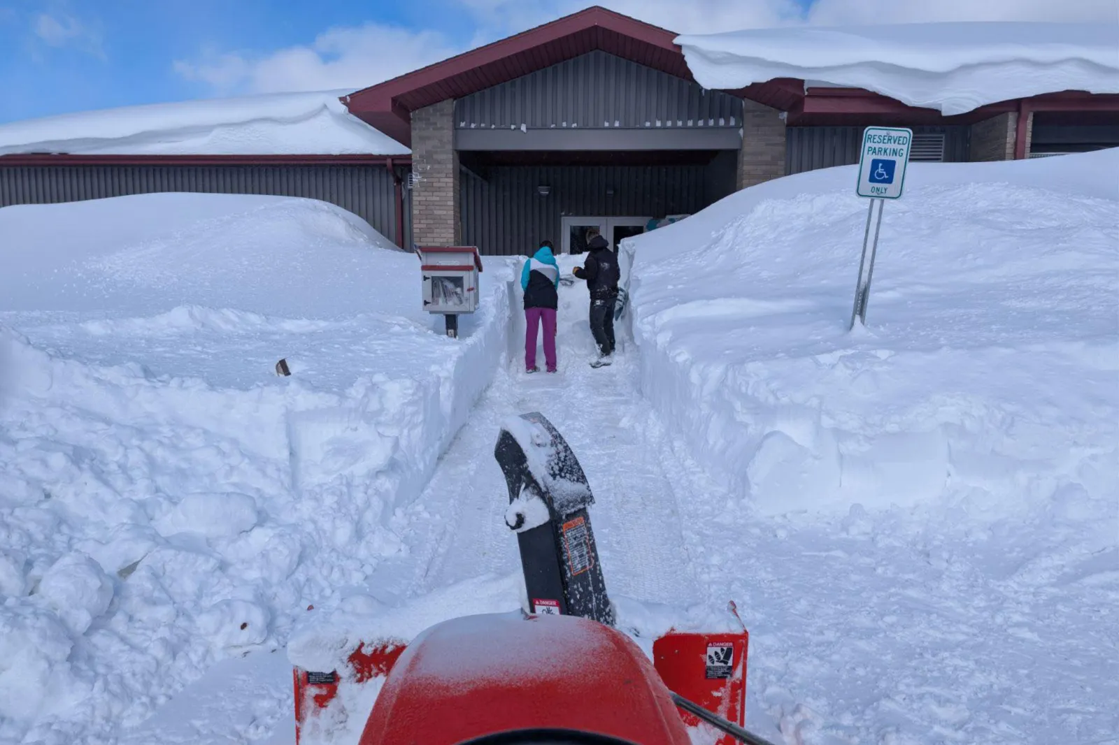 Snowplow making path to shelter