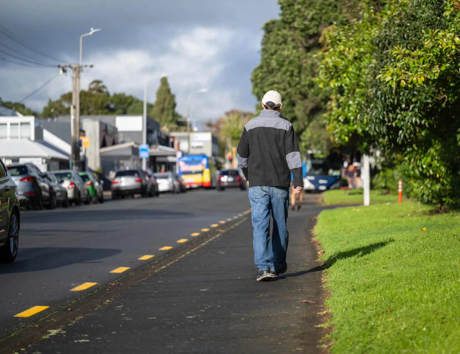 Man walking on a pedestrian footpath.