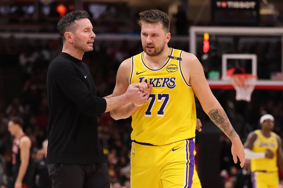Los Angeles Lakers star Luka Doncic in a conversation with head coach JJ Redick