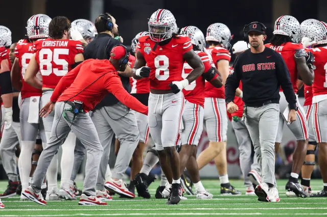 Arvell Reese #8 of the Ohio State Buckeyes reacts after a defensive play in the first half during the College Football Playoff Quarter Final Game against the Miami Hurricanes at AT&T Stadium on December 31, 2025 in Arlington, Texas.