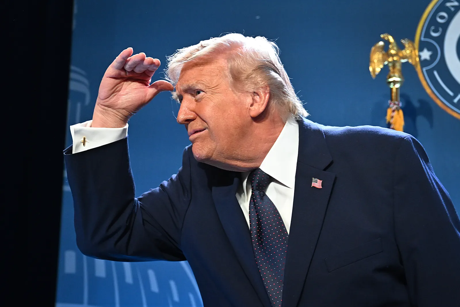 President Donald Trump exits the stage after speaking at the Republican Members Issues Conference at Trump National Doral Miami on Monday in Doral, Florida. (Photo by Roberto Schmidt/Getty Images)