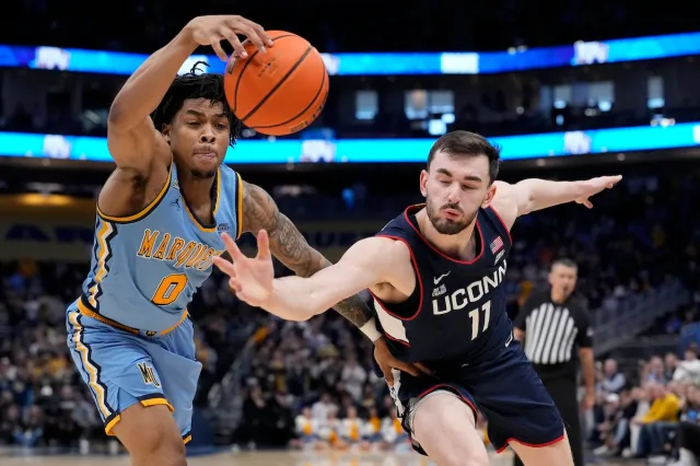 UConn Huskies forward Alex Karaban extends to get the ball against Marquette
