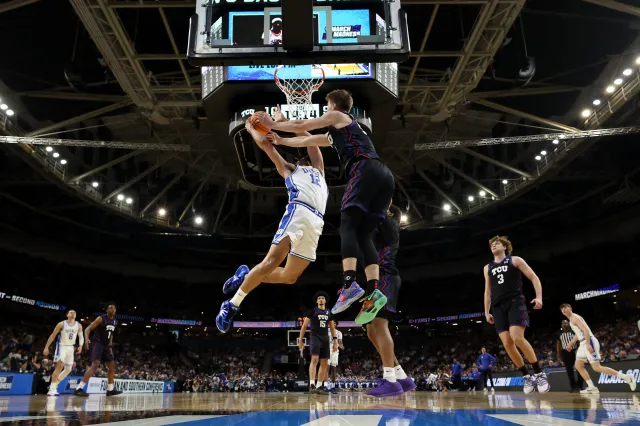 Cameron Boozer #12 of the Duke Blue Devils shoots the ball against Tanner Toolson #55 of the Texas Christian University Horned Frogs during the first half in the second round of the 2026 NCAA Men's Basketball Tournament at Bon Secours Wellness Arena on March 21, 2026 in Greenville, South Carolina.