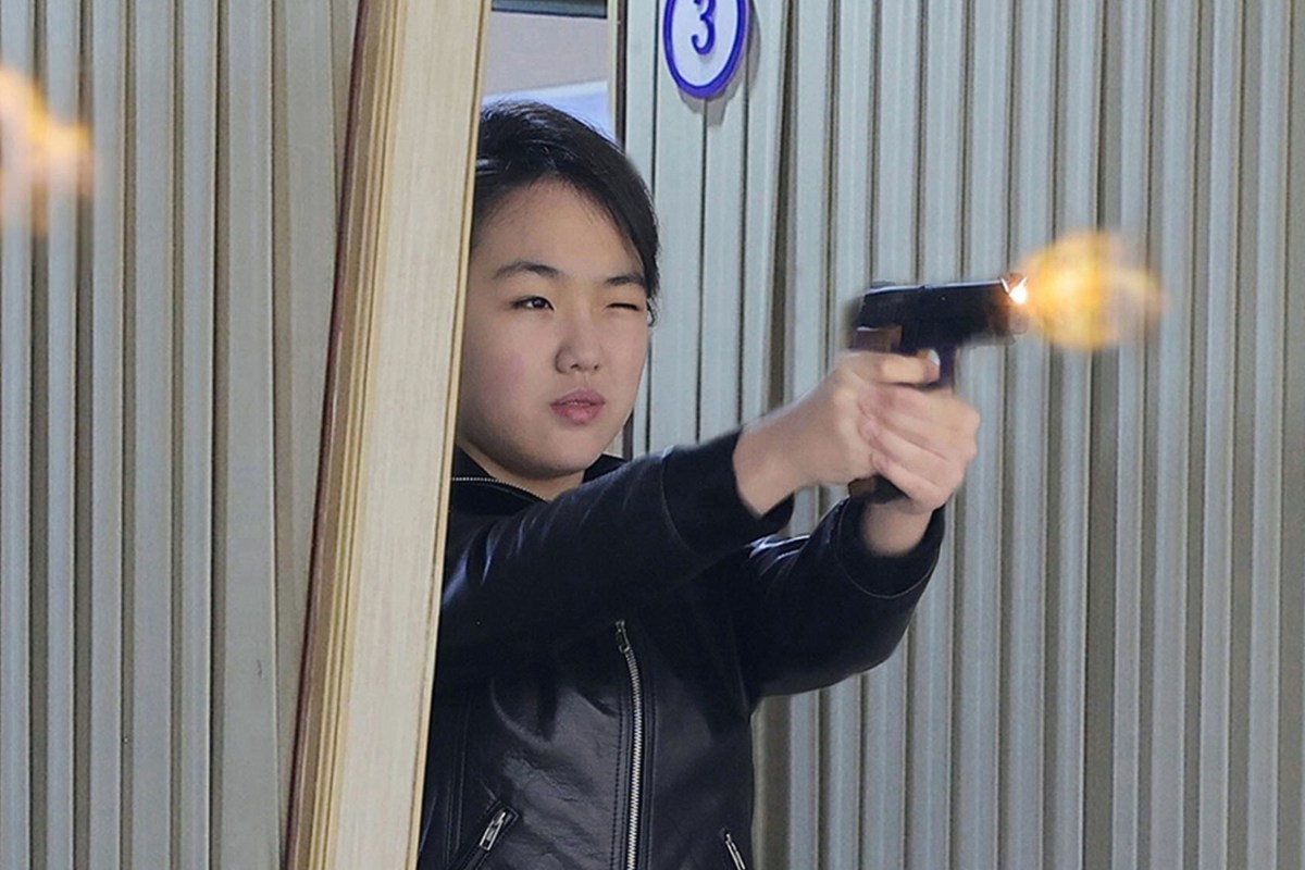 North Korea Leader Pictured Firing Gun Next to Teen Daughter