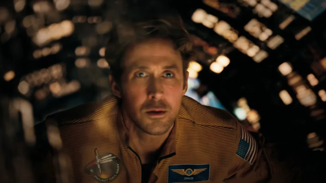 A man in a spaceship stares in disbelief