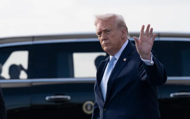 U.S. President Donald Trump waves after landing at Palm Beach International Airport on March 20, 2026 in Palm Beach, Florida.