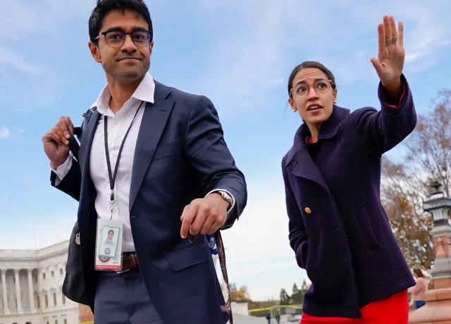 Rep.-elect Alexandria Ocasio-Cortez, D-NY., right, and her chief of staff Saikat Chakrabarti, left, walk back together after joining other members of the freshman class of Congress for a group photo on Capitol Hill in Washington, Wednesday, Nov. 14, 2018. (AP Photo/Pablo Martinez Monsivais)