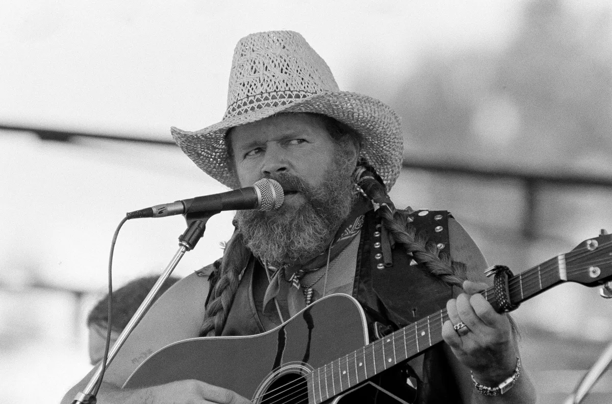 David Allan Coe performing at the Atlanta International Raceway in 1983.