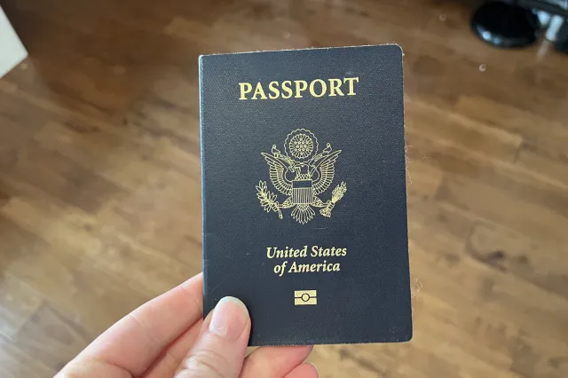 Person holding a United States passport with Department of State logo visible, Lafayette, California, May 23, 2023.