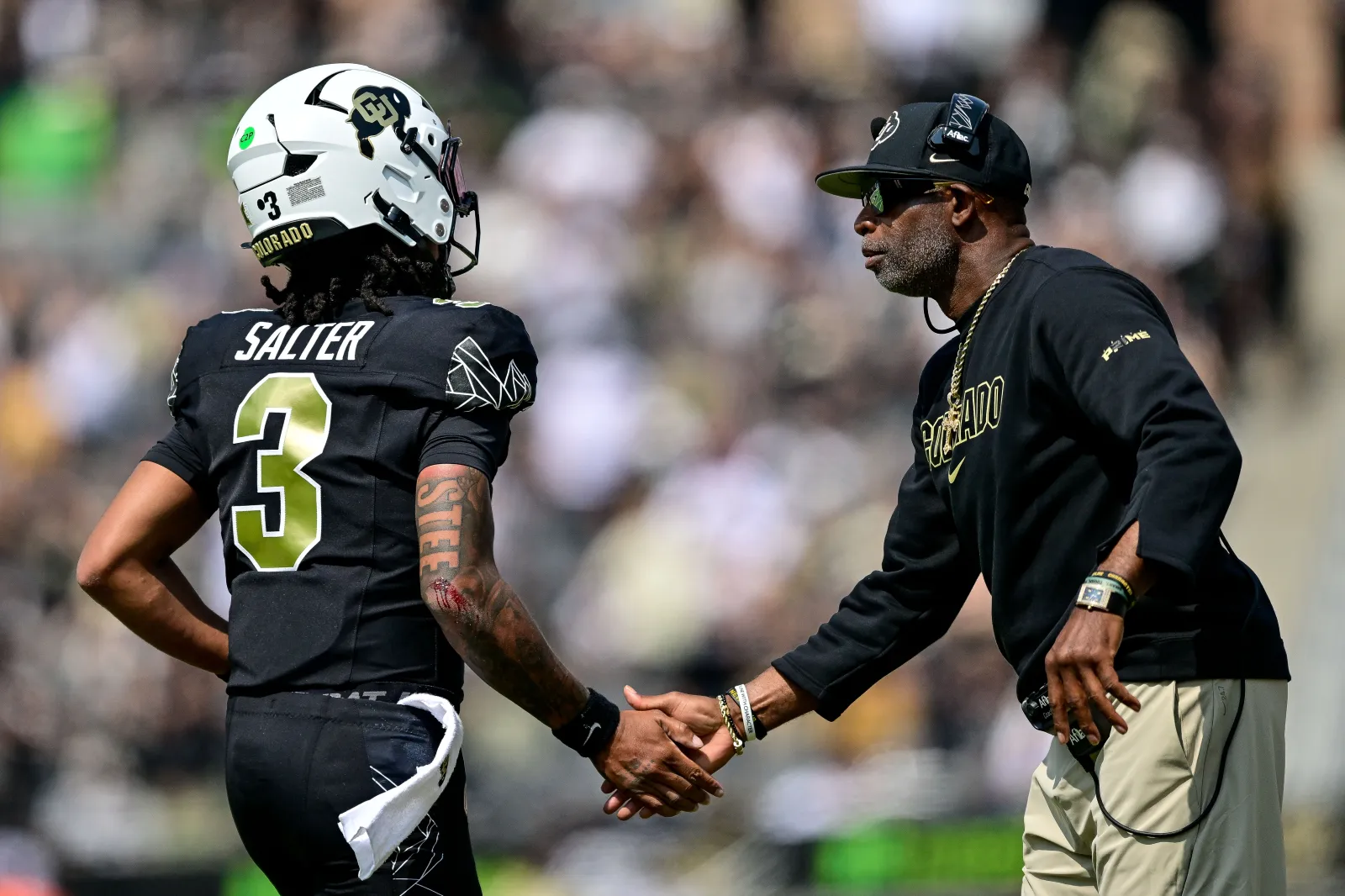 Former Colorado QB Kaidon Salter and head coach Deion Sanders