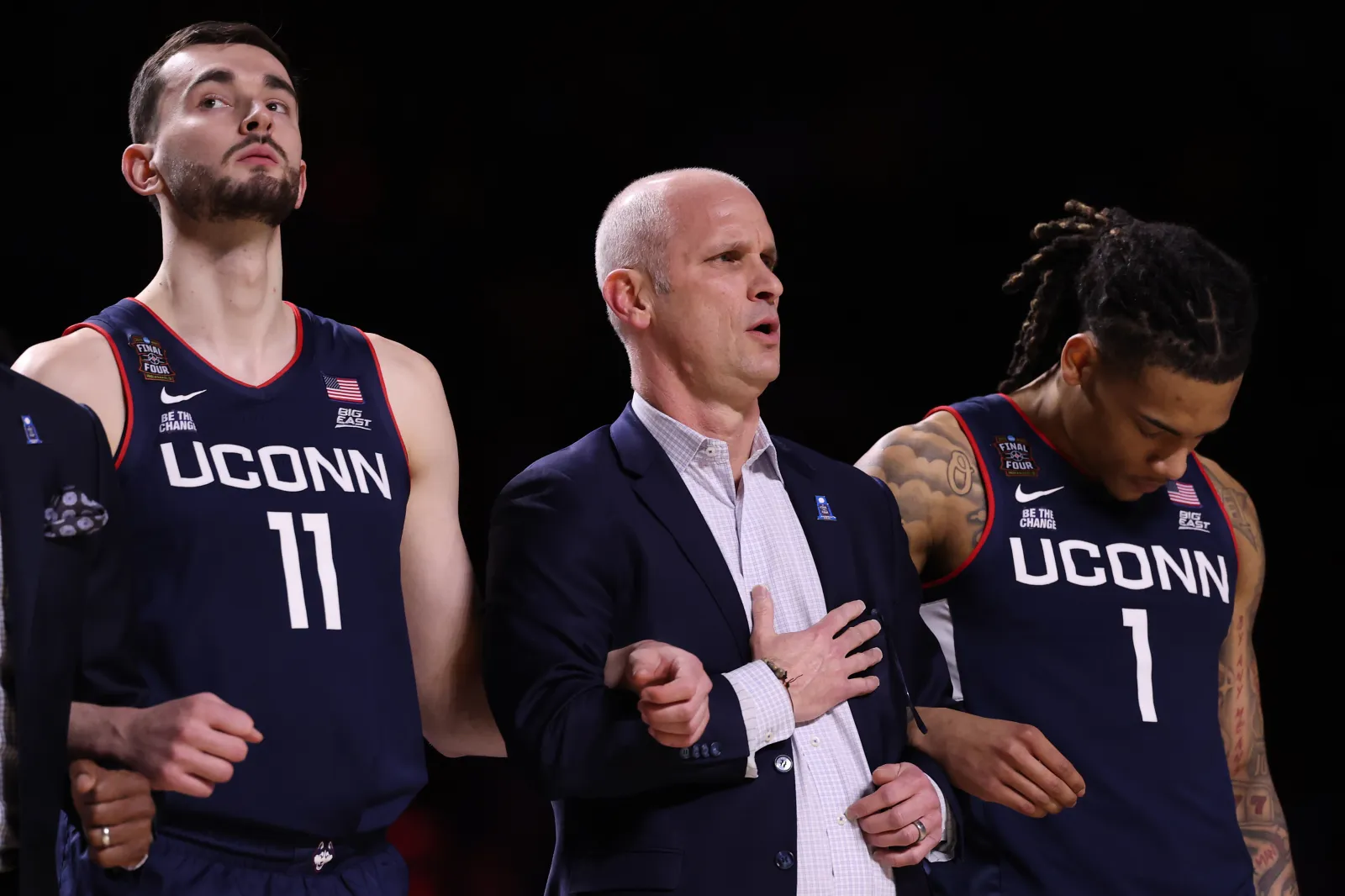 UConn head coach Dan Hurley with players Alex Karaban and Solo Ball.