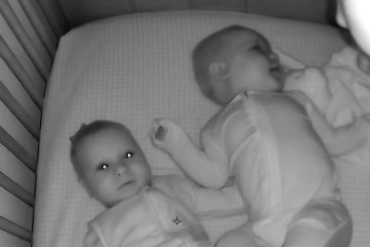 Twin Comforts Baby Brother in Crib—Then Camera Captures Something Amazing