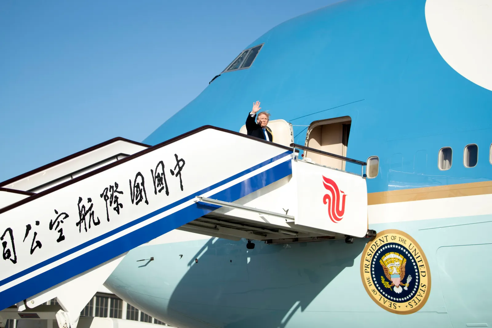 President Donald Trump boards Air Force One at Beijing Airport in China on November 10, 2017, to travel to Danang, Vietnam, during a five-country Asian trip. (AP Photo/Andrew Harnik)
