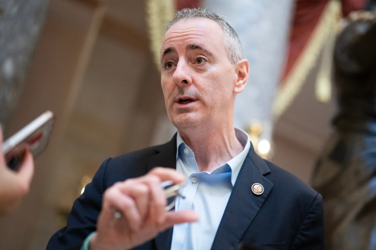 Rep. Brian Fitzpatrick, R-Pa., talks with a reporter in the U.S. Capitol's Statuary Hall on Friday, March 27, 2026. (Tom Williams/CQ Roll Call via AP Images)