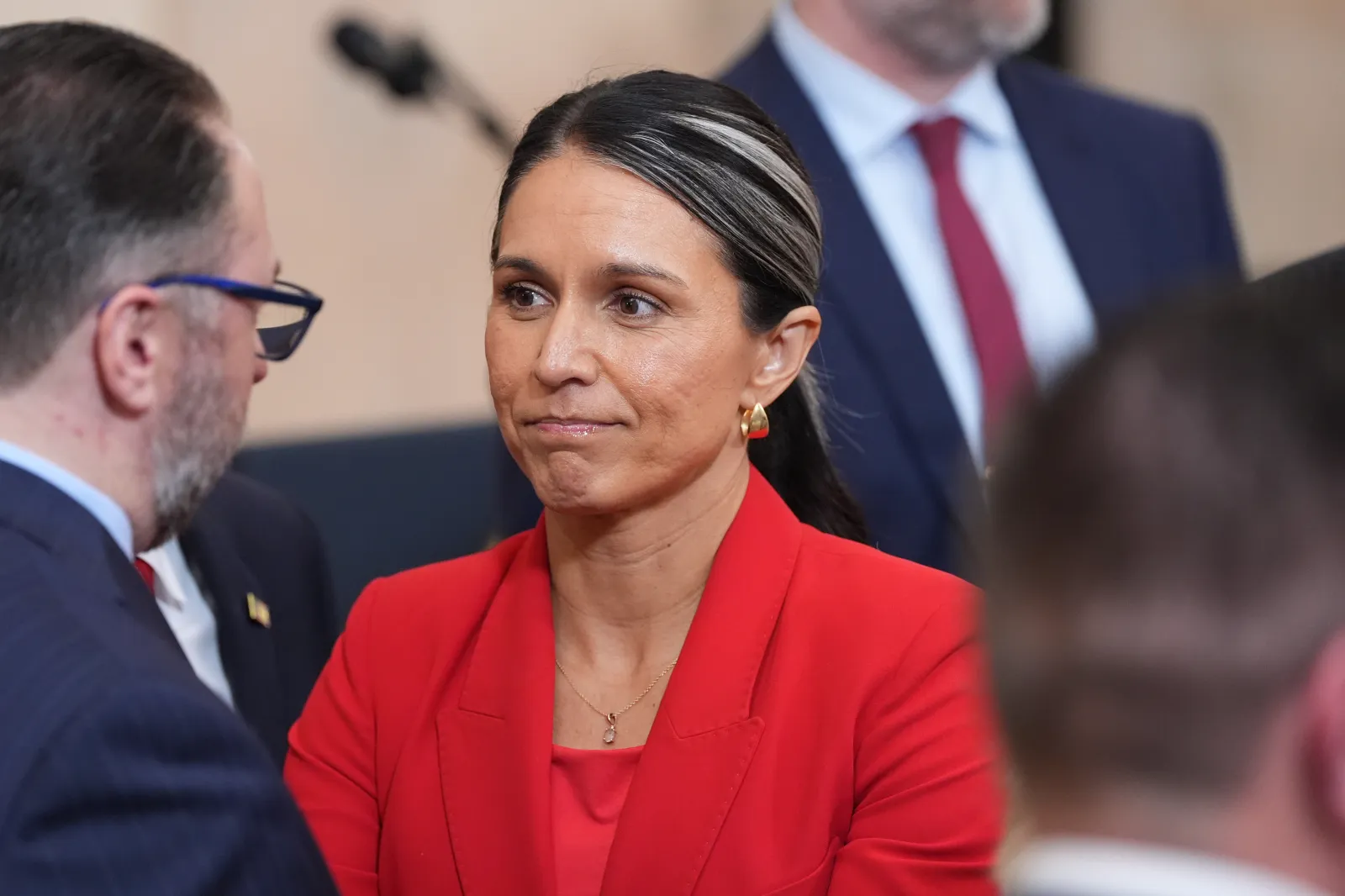 Director of National Intelligence Tulsi Gabbard stands after President Donald Trump spoke about the Iran war from the Cross Hall of the White House on April 1, 2026, in Washington.