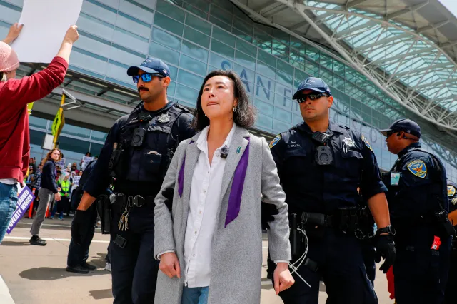 Supervisor Connie Chan is arrested as she stands with other demonstrators blocking the road in front of San Francisco International terminal during ICE Out of San Francisco protest at SFO on May Day at San Francisco International Airport on Friday, May 1, 2026, in San Francisco. (Lea Suzuki/San Francisco Chronicle via AP)