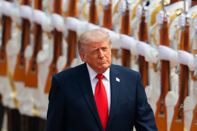 U.S. President Donald Trump inspects an honor guard during a welcome ceremony at the Great Hall of the People in Beijing, Thursday, May 14, 2026.