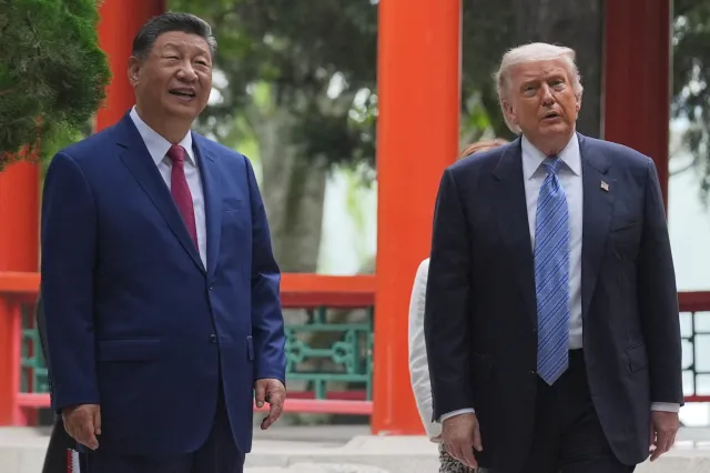 President Donald Trump talks with Chinese President Xi Jinping at the Zhongnanhai leadership compound on May 15, 2026, in Beijing.