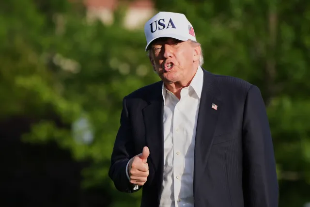 President Donald Trump gestures to reporters as he walks across the South Lawn of the White House, Friday, May 15, 2026, in Washington, on return from Beijing where he met with China's President Xi Jinping.