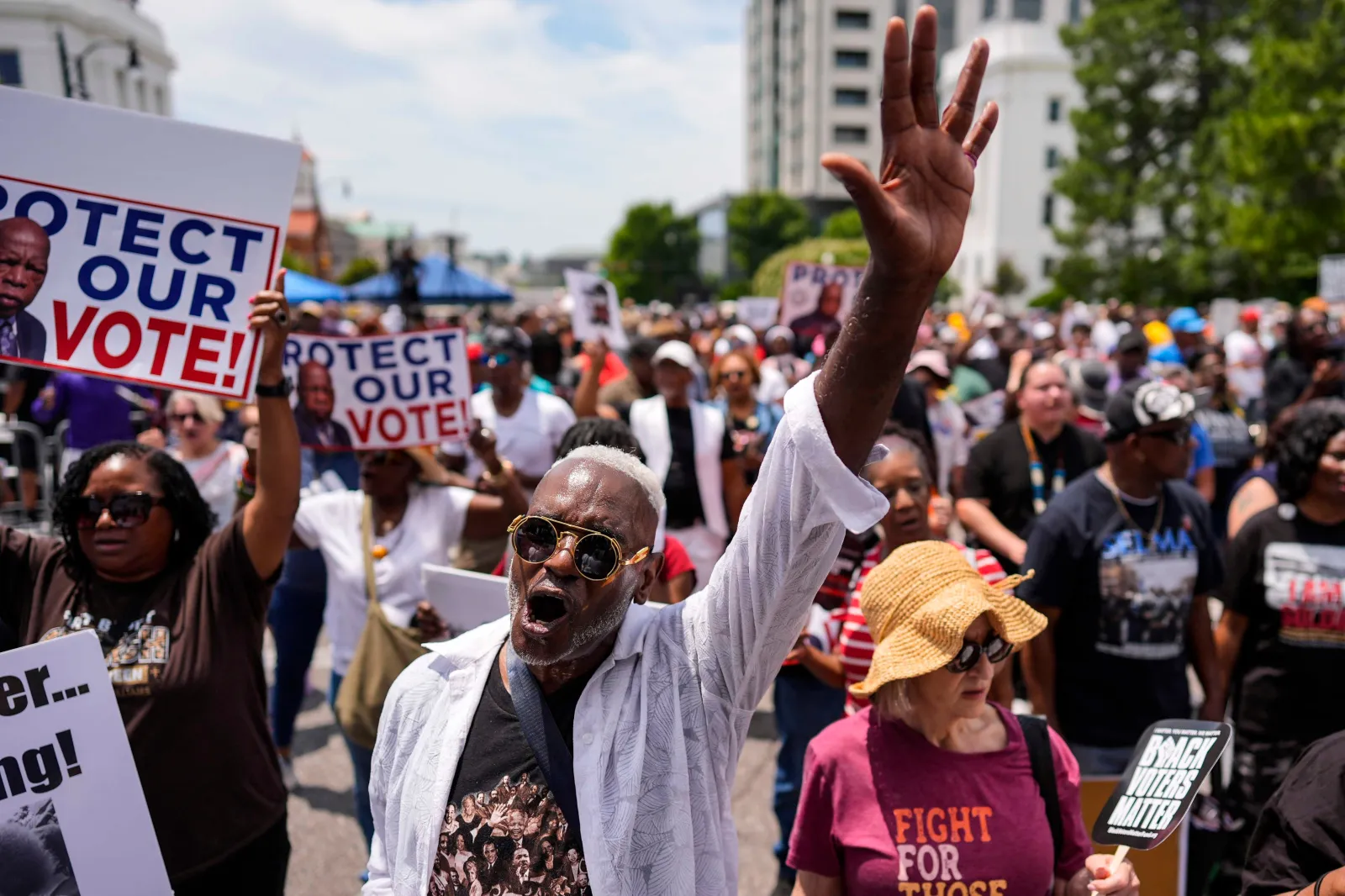 A man sings a spiritual song during a voting rally on May 16 in Montgomery, Alabama. (AP Photo/Mike Stewart)