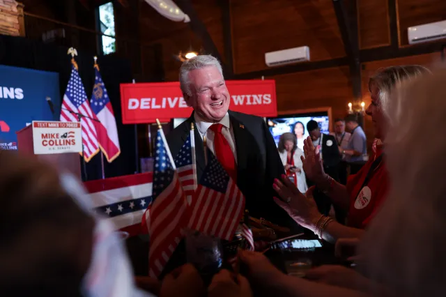 Representative Mike Collins greets supporters as he arrives at his primary election watch party in Jackson, Georgia, on May 19, 2026.