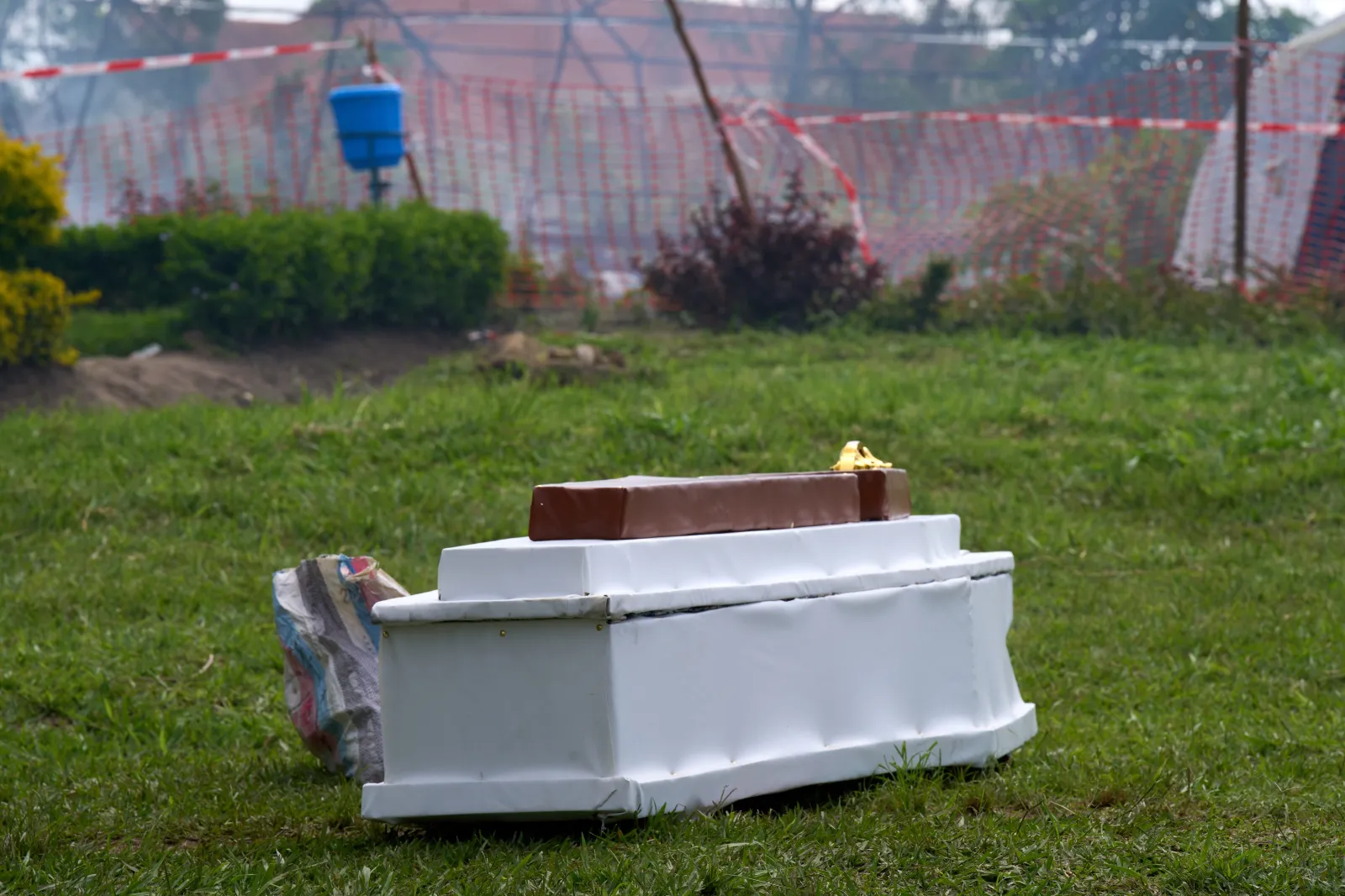 A coffin lays on the ground next to an Ebola treatment center in Rwampara, Congo, on May 21. (AP Photo/Dirole Lotsima Dieudonne)
