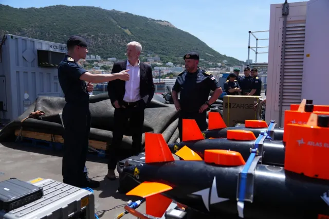 British Armed Forces Minister Al Carns, center, is seen on RFA Lyme Bay in Gibraltar on May 22, 2026.